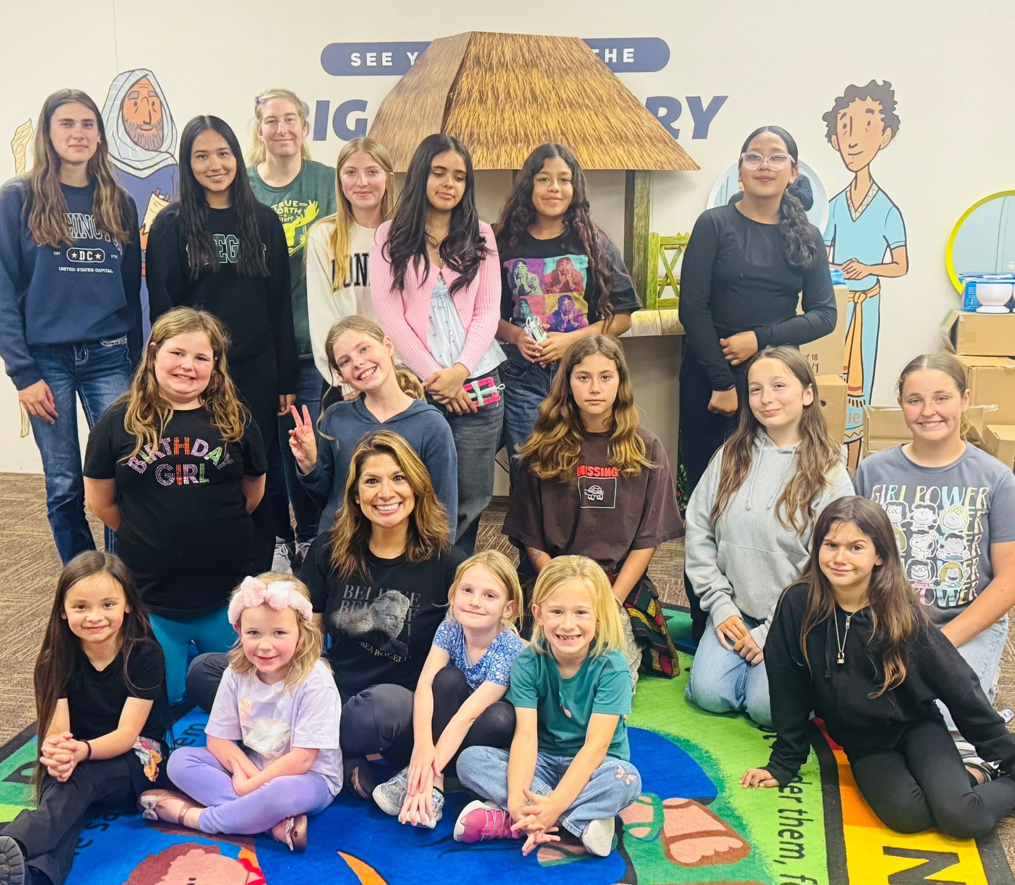 GEMS Girls Club group photo in a classroom