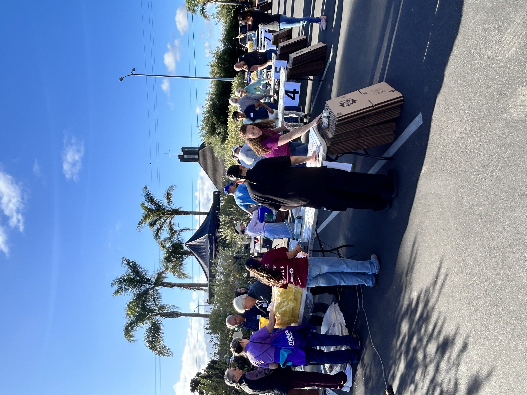 Volunteers assembled in the church parking lot for a Kids Around the World packing line