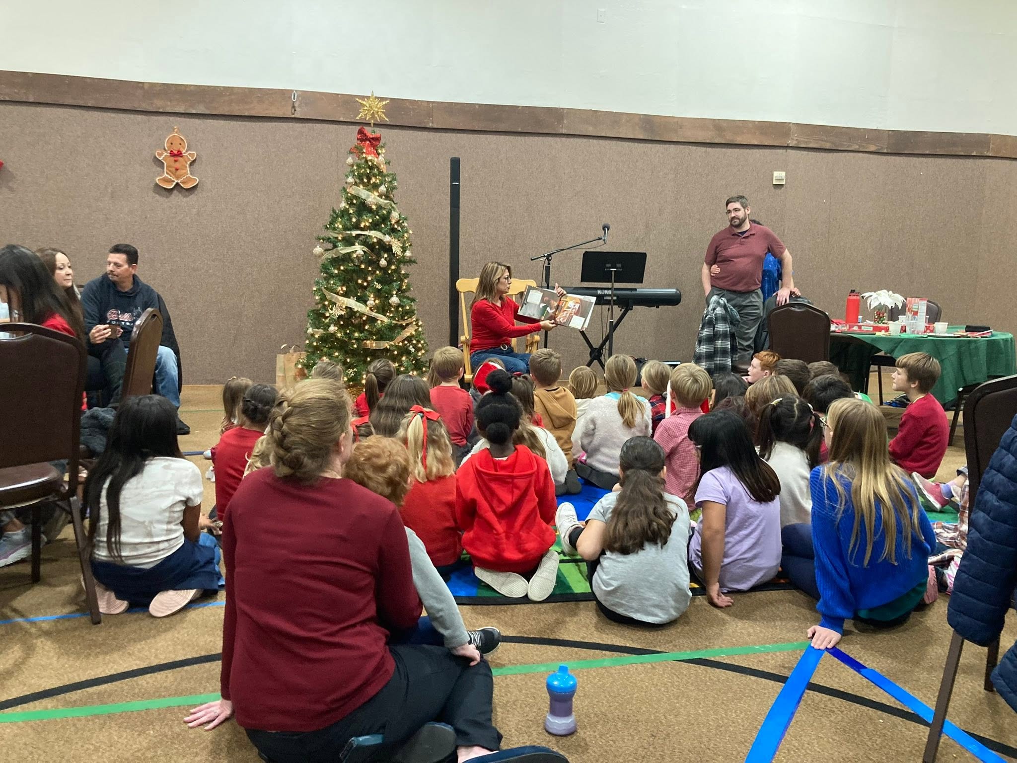 Children listening to a Christmas story in the fellowship hall