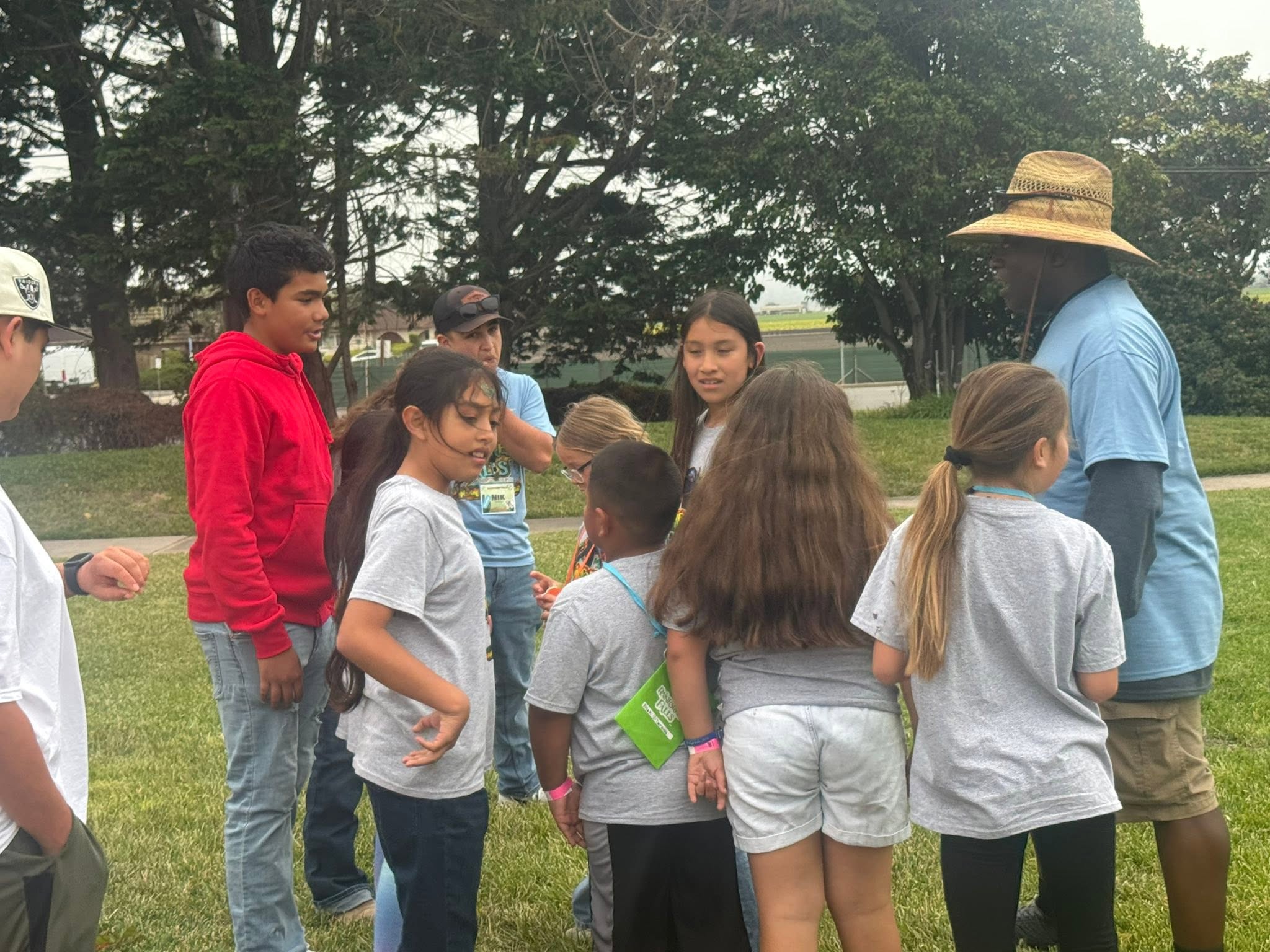 Kids and leaders gathered outdoors during Vacation Bible School